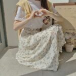 FALDA MIDI ACAMPANADA CON ESTAMPADO FLORAL